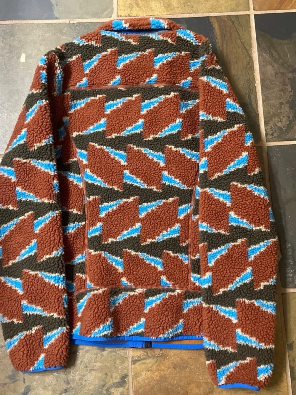 Patagonia sherpa fleece jacket in bright blue and brown pattern